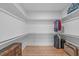 Spacious walk-in closet with built-in shelving and ample storage space for clothing and accessories at 428 Beaverdam Lake Dr, Fuquay Varina, NC 27526