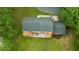 Aerial view of home showcasing large wooden deck, multi-car driveway, and grassy yard at 4508 Old Us 421 N, Siler City, NC 27344