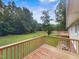 Expansive backyard with mature trees, accessed by a wooden deck, perfect for outdoor entertaining and relaxation at 4508 Old Us 421 N, Siler City, NC 27344