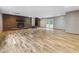 A finished basement offers a brick fireplace, neutral walls, and a walkout entrance at 4508 Old Us 421 N, Siler City, NC 27344