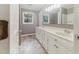 Bathroom with double sink vanity and a large mirror, offering a functional and well-lit space at 4508 Old Us 421 N, Siler City, NC 27344