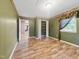 Bedroom featuring wood-look floors, large closet, and a decorative wallpaper border at 4508 Old Us 421 N, Siler City, NC 27344