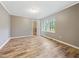 This bedroom features wood-look floors, neutral walls, and a walk-in closet at 4508 Old Us 421 N, Siler City, NC 27344