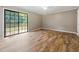 Cozy bedroom with vinyl plank flooring, featuring sliding glass door to access to the outside at 4508 Old Us 421 N, Siler City, NC 27344