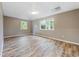 Bedroom featuring vinyl flooring, neutral paint, and double windows for natural light at 4508 Old Us 421 N, Siler City, NC 27344