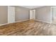 Bedroom featuring vinyl plank flooring, with two closets and a door leading to an ensuite bath at 4508 Old Us 421 N, Siler City, NC 27344