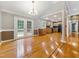 Bright dining area adjacent to the kitchen, featuring hardwood floors and access to the outdoors via French doors at 4508 Old Us 421 N, Siler City, NC 27344