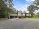 Charming two-story home featuring a spacious front yard and attached two-car garage at 4508 Old Us 421 N, Siler City, NC 27344