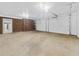 Spacious garage featuring multiple garage doors, brick accent wall, and high ceilings at 4508 Old Us 421 N, Siler City, NC 27344