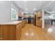 Well-lit kitchen boasts oak cabinets, modern appliances, and hardwood floors, perfect for culinary enthusiasts at 4508 Old Us 421 N, Siler City, NC 27344