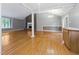 A spacious living room with hardwood floors, a fireplace, and a vaulted ceiling at 4508 Old Us 421 N, Siler City, NC 27344