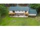 Aerial view of home showcasing large wooden deck, multi-car driveway, and grassy yard at 4508 Old Us 421 N, Siler City, NC 27344