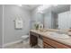 Well-lit bathroom features a vanity with a sink, decorative towels, and a framed art piece at 469 Winding Wood Dr, Clayton, NC 27520