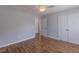 A spacious bedroom with natural light, a ceiling fan, and a double door closet at 469 Winding Wood Dr, Clayton, NC 27520