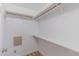 Walk-in closet with wooden clothing rods and shelves, providing ample storage space at 469 Winding Wood Dr, Clayton, NC 27520