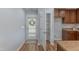 An open pantry and backdoor entrance are seen from the kitchen at 469 Winding Wood Dr, Clayton, NC 27520