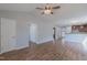 Spacious living room with hardwood floors, view into kitchen, and multiple doorways at 469 Winding Wood Dr, Clayton, NC 27520