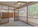 Relaxing screened-in porch area offering views of the outdoors with a ceiling fan at 469 Winding Wood Dr, Clayton, NC 27520
