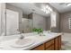 Bathroom with double sink vanity and white countertop and framed mirror at 4725 Sinclair Dr, Raleigh, NC 27616