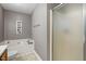Bathroom with tub, shower, and gray walls at 4725 Sinclair Dr, Raleigh, NC 27616
