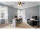 Comfortable bedroom with a work space and recliner offering a perfect home office at 4725 Sinclair Dr, Raleigh, NC 27616