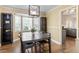 Bright dining room featuring hardwood floors, a modern chandelier, and large bay window at 4725 Sinclair Dr, Raleigh, NC 27616