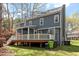 Rear exterior view with deck, showcasing the home's architecture and outdoor space at 4725 Sinclair Dr, Raleigh, NC 27616