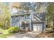 Charming two-story home featuring a well-manicured lawn and attached garage, painted in light blue at 4725 Sinclair Dr, Raleigh, NC 27616