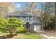 Charming two-story home featuring a well-manicured lawn and attached garage, painted in light blue at 4725 Sinclair Dr, Raleigh, NC 27616
