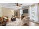 Warm living room with wood floors, comfortable seating, and large windows at 4725 Sinclair Dr, Raleigh, NC 27616