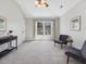 Spacious bedroom featuring vaulted ceilings, plush carpeting, and ample natural light from large windows at 4818 Glendarion Dr, Durham, NC 27713