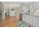 Kitchen featuring stainless appliances, granite countertops, and white cabinets at 4818 Glendarion Dr, Durham, NC 27713