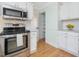 Close-up of oven and access to pantry in the kitchen at 4818 Glendarion Dr, Durham, NC 27713