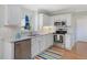 Kitchen featuring stainless appliances, granite countertops, and white cabinets at 4818 Glendarion Dr, Durham, NC 27713