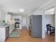 Kitchen featuring stainless appliances and access to dining room at 4818 Glendarion Dr, Durham, NC 27713