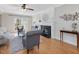 Bright living room showcasing hardwood floors, a fireplace with mantel decor, and comfortable seating arrangements at 4818 Glendarion Dr, Durham, NC 27713