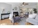 Cozy living room features a fireplace, hardwood floors, neutral color palette, and comfortable seating at 4818 Glendarion Dr, Durham, NC 27713