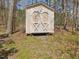 Shed with double doors and a white trim at 4818 Glendarion Dr, Durham, NC 27713