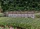 Hope Valley Farms community entrance sign featuring stone and lush greenery at 4818 Glendarion Dr, Durham, NC 27713