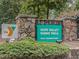 Hope Valley Farms YMCA sign with stone accents, green shrubbery, and visible street address at 4818 Glendarion Dr, Durham, NC 27713