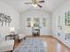 Bright and airy sun room with hardwood floors, lots of natural light, and a vaulted ceiling at 4818 Glendarion Dr, Durham, NC 27713