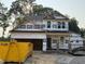 New home under construction featuring attached two-car garage and stone accents at 49 Fetterbush Way, Clayton, NC 27520