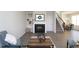 Inviting living room with a fireplace, shelving, and stylish décor, creating a comfortable atmosphere at 49 Fetterbush Way, Clayton, NC 27520