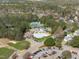 Aerial image featuring community swimming pool, tennis courts, parking, and golf course with sand trap at 5220 Linksland Dr, Holly Springs, NC 27540