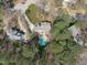 High above, the home stands out with its inviting pool and serene, tree-lined surroundings, promising peaceful living at 5220 Linksland Dr, Holly Springs, NC 27540