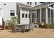 Backyard patio with outdoor dining table and chairs, perfect for entertaining at 5220 Linksland Dr, Holly Springs, NC 27540