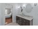 Stylist bathroom with double sinks and mirrors, seamlessly connects to bedroom at 5220 Linksland Dr, Holly Springs, NC 27540