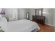 Spacious bedroom with a comfortable bed and a large mirror near the dresser at 5220 Linksland Dr, Holly Springs, NC 27540