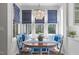 Charming breakfast nook with crystal chandelier offers a cozy spot with backyard views at 5220 Linksland Dr, Holly Springs, NC 27540