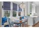 Cozy breakfast nook with a chandelier and cushioned bench seating offers scenic backyard views at 5220 Linksland Dr, Holly Springs, NC 27540